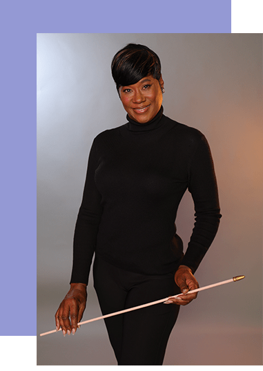 A woman wearing a black shirt is holding a baton confidently in her hand.